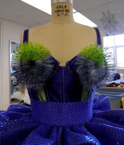 Final bodice with green glitter stripes and brushes attached with Velcro.